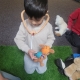 Child using stethoscope on teddy