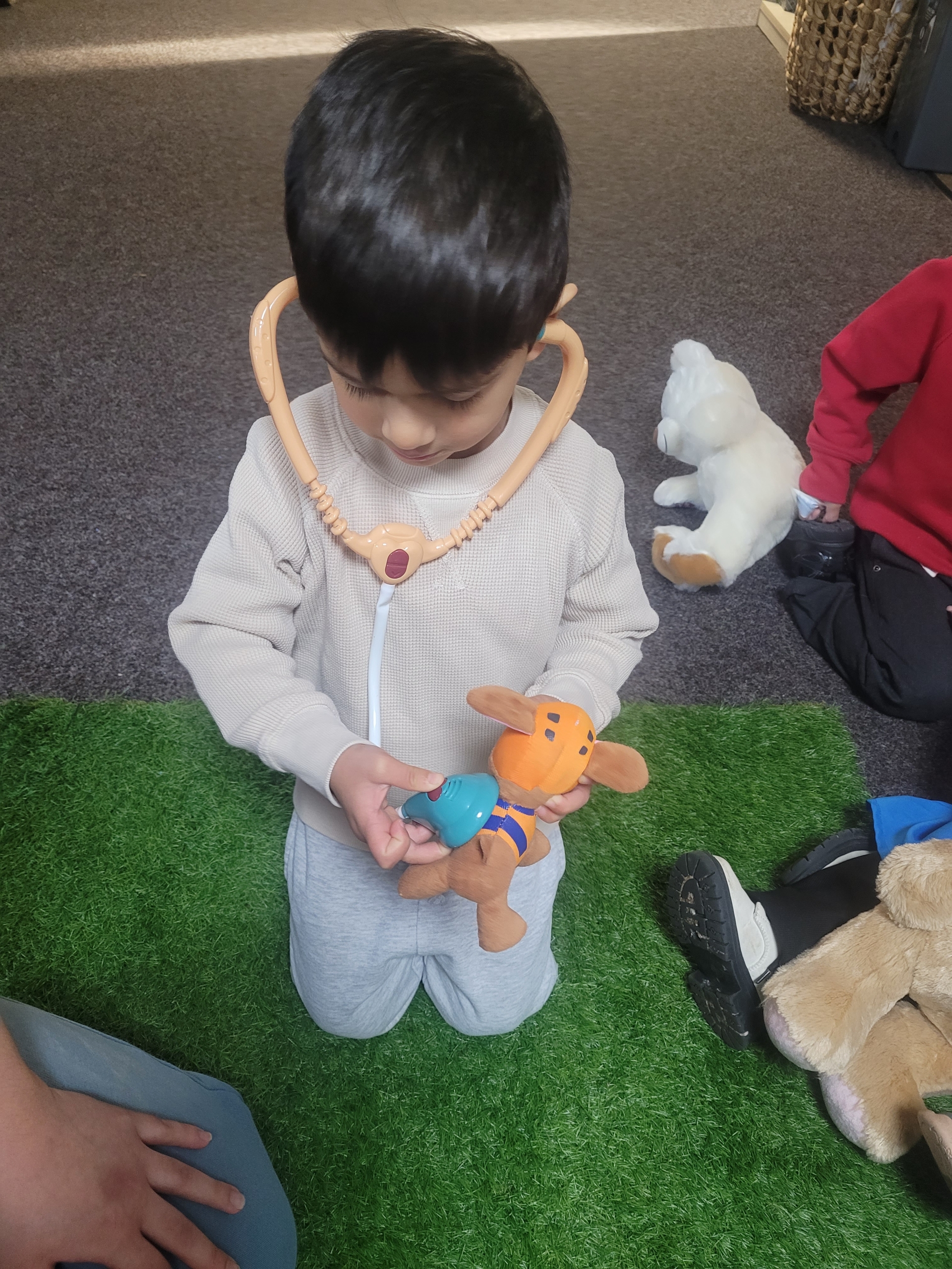 teddy-hospital1 Child using stethoscope on teddy